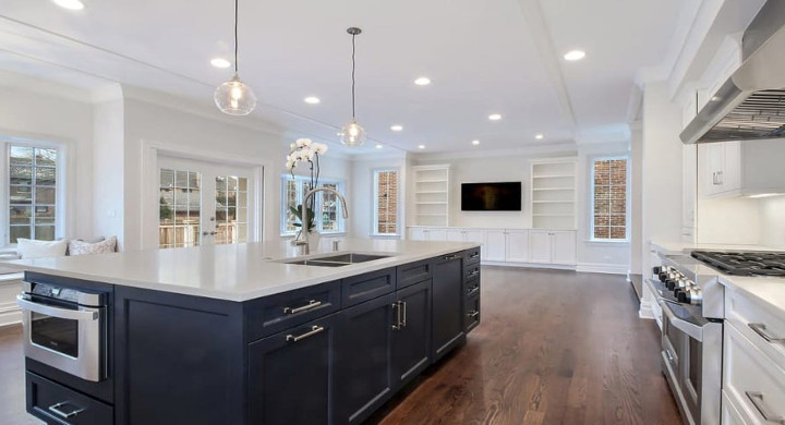 Wilmette traditional kitchen remodel project with kitchen Island and ovens with industrial hood