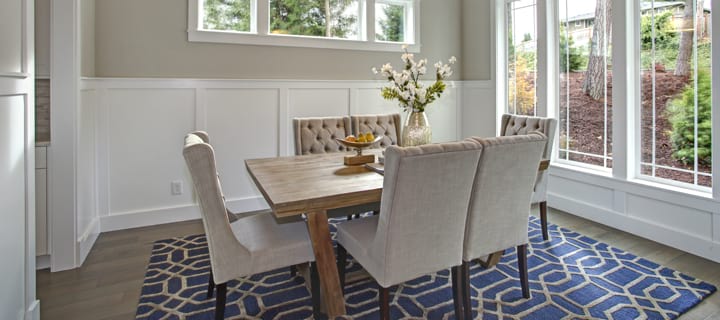 Transitional style interior design in dining room with board and batten walls