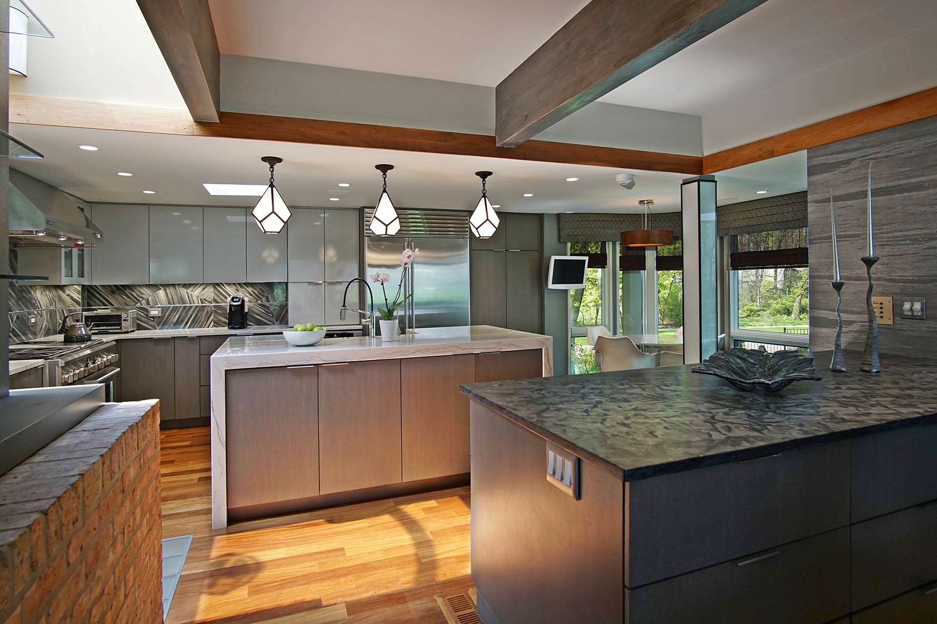 Fabulous two tone kitchen cabinets combined with big eating area in Lake Forest
