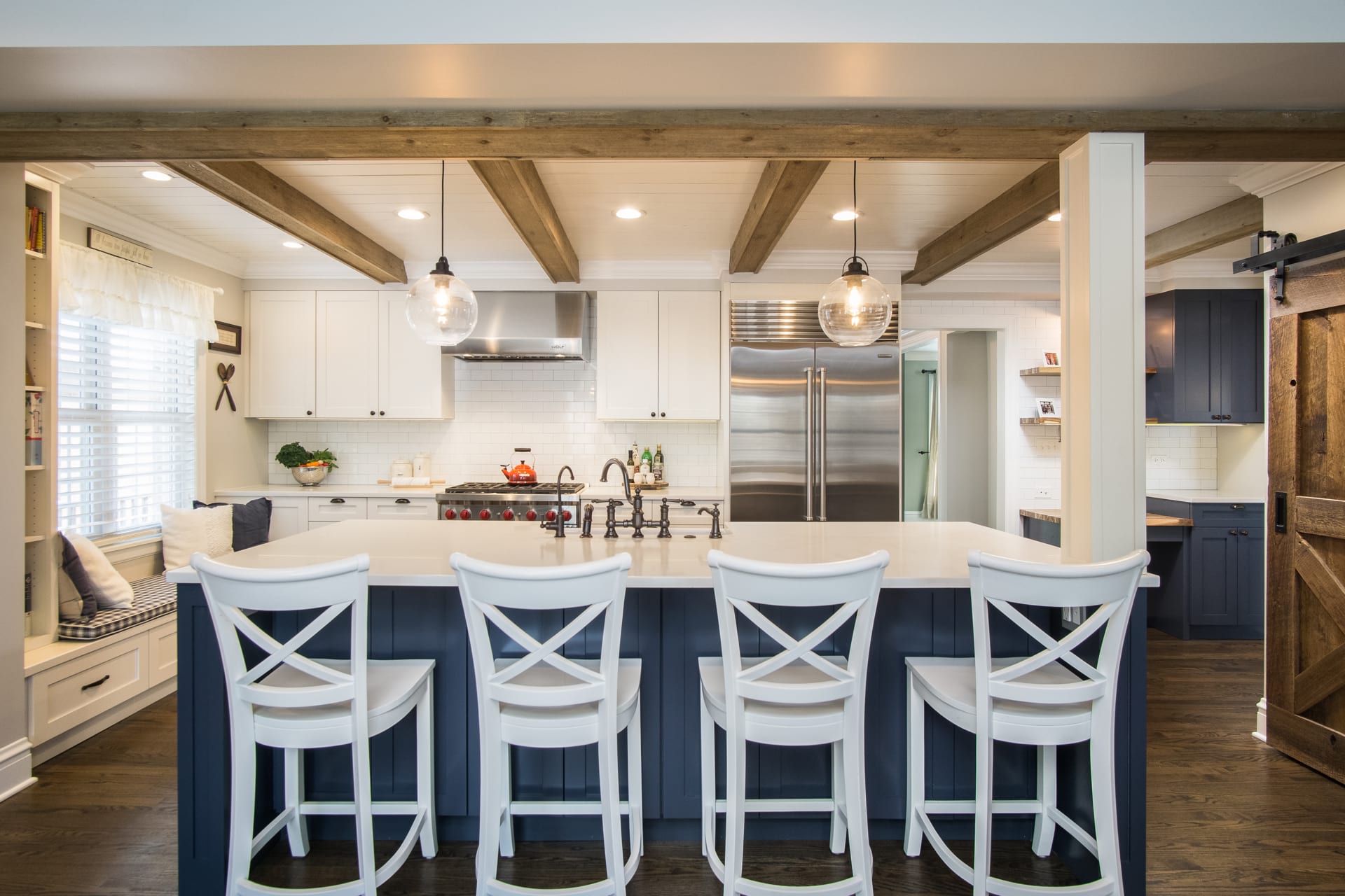 open white kitchen with chairs in chicago
