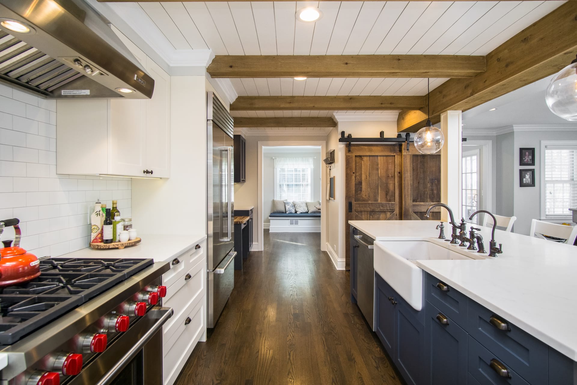 wooden floor kitchen with blue cupboards