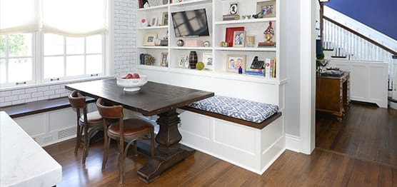Luxury white dining space with modern shelves design in Kenilworth