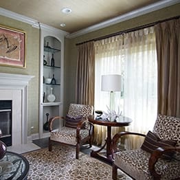 Bright unique living space with two armchairs and large windows in Highland Park