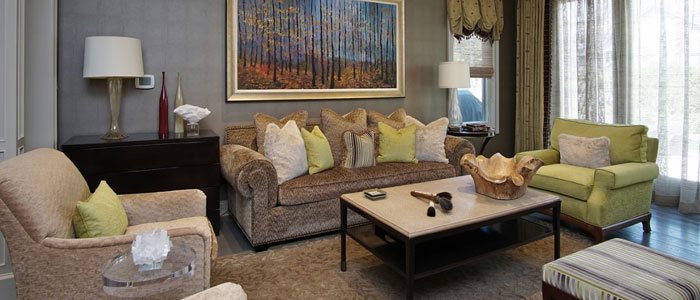 Neutral eclectic coastal family room with table and unique painting in Highland Park
