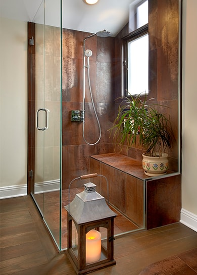 Stylish brown enclosed glass shower with lantern element in Chicago