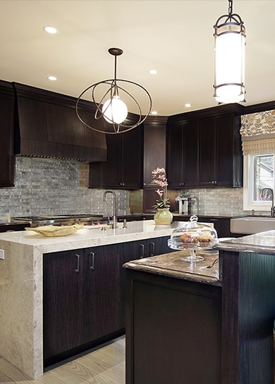 Modern brown color kitchen design with island in Highland Park