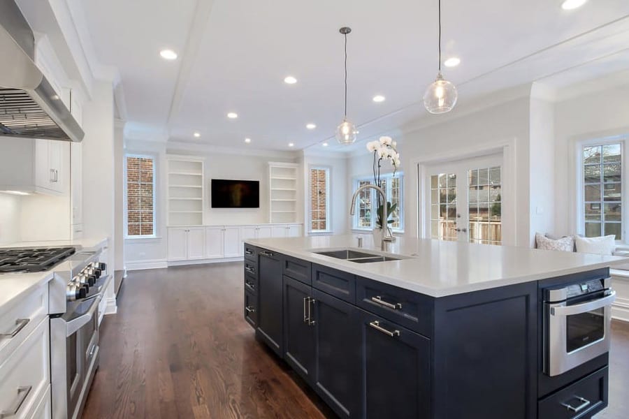 Wilmette traditional kitchen remodeling project with island houses the sink