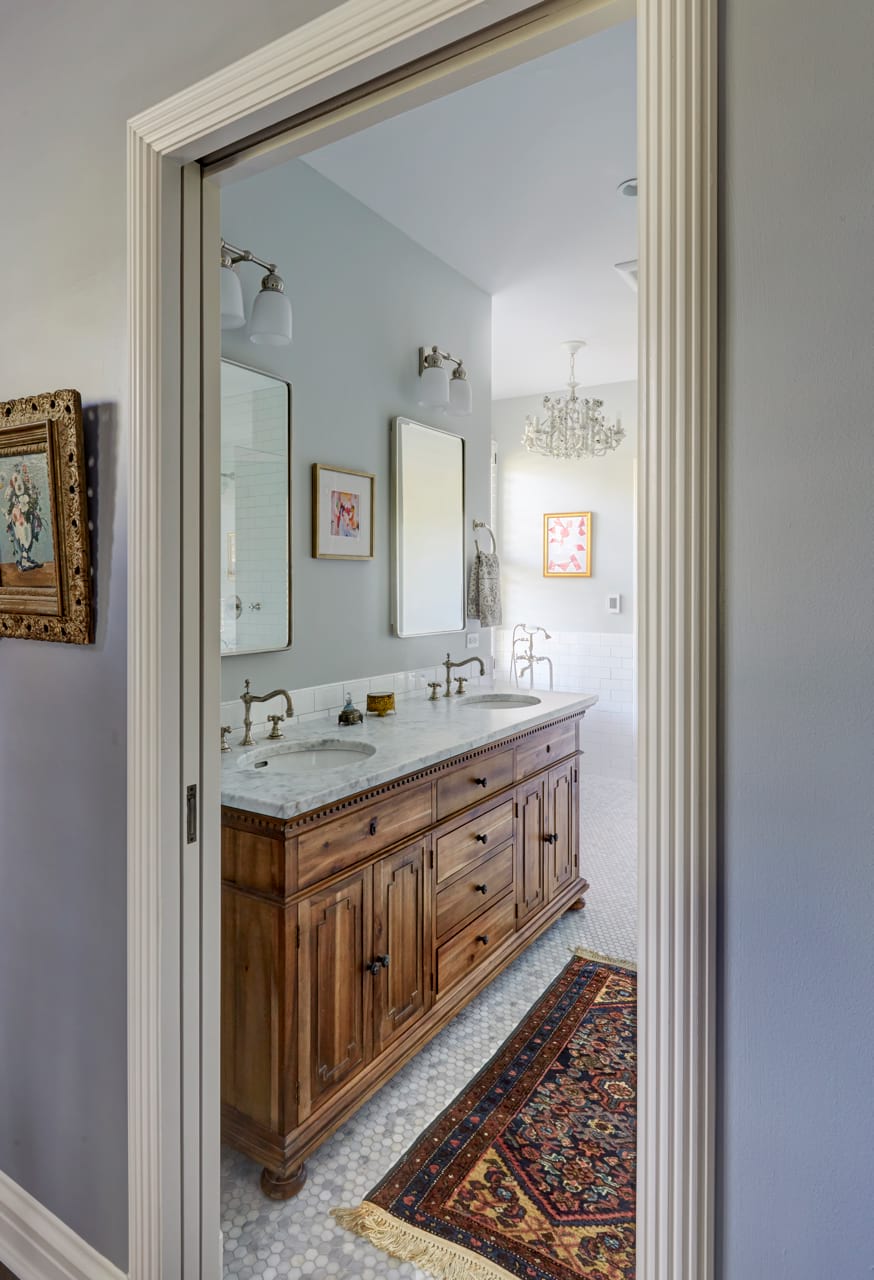 White tile bathroom design with fresh look furniture