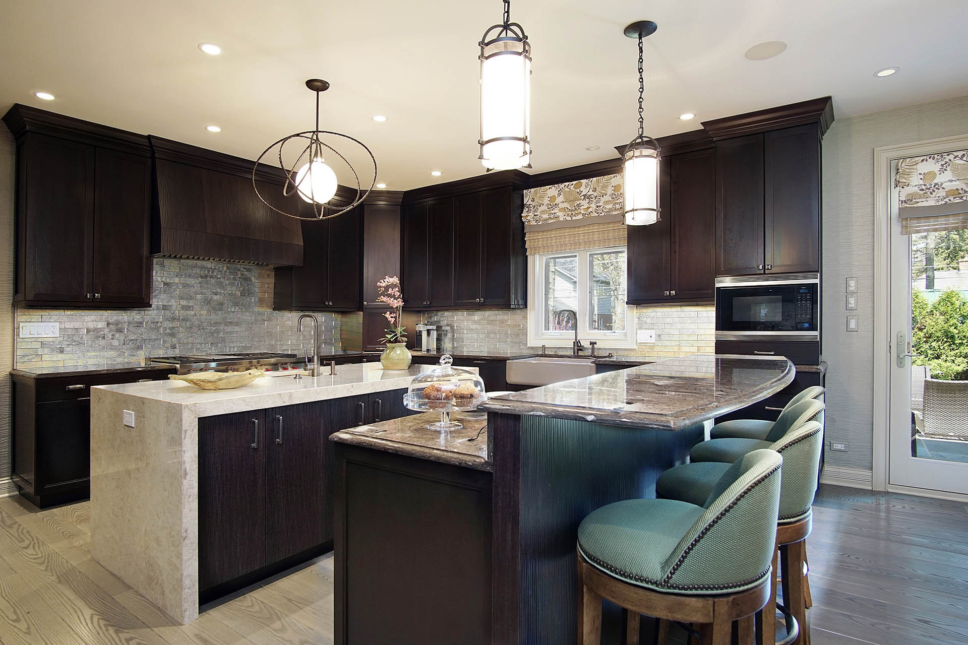 Modern brown color kitchen design with island in Highland Park