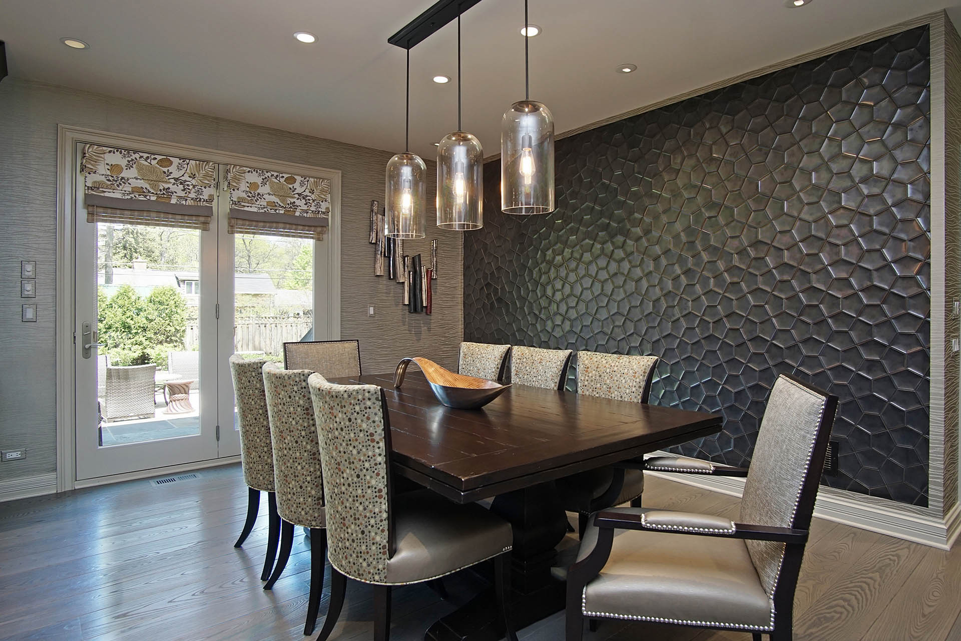 Beautiful dining room space with comfortable chairs and amazing wall decor in Highland Park