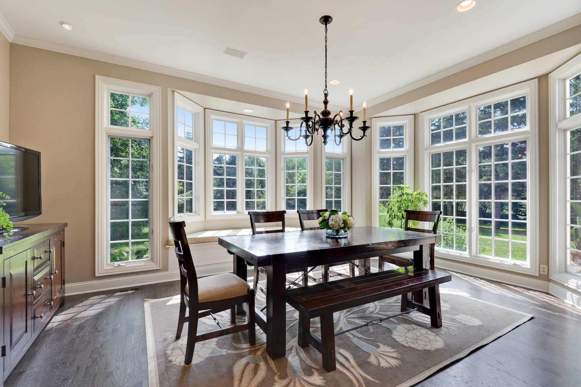 Living room table with large windows in lake forest