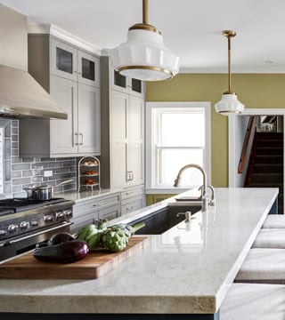 Subway tiles on walls and cement tile floor in the kitchen design in Chicago