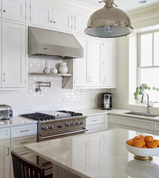 Single white color kitchen furniture with beautiful island after remodel in Chicago